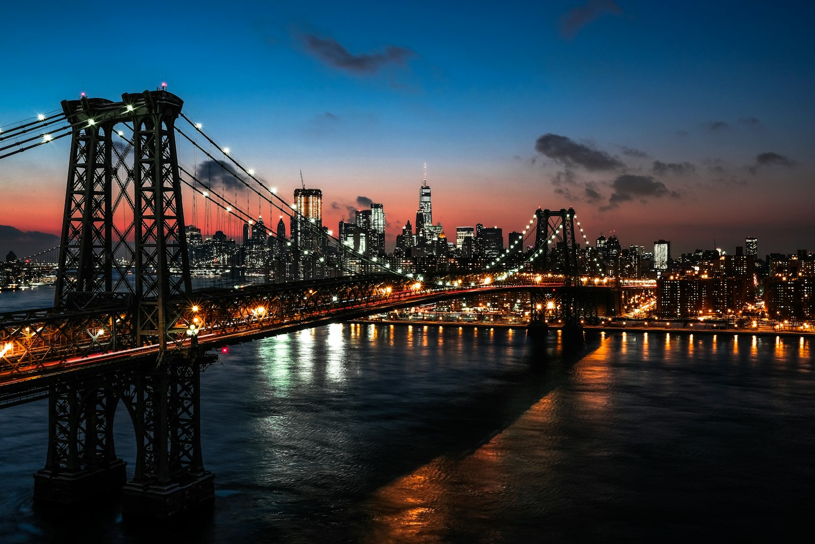 Dark city skyline under a cloudy night sky